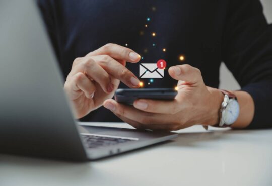 phone in hand with messaging icon animation