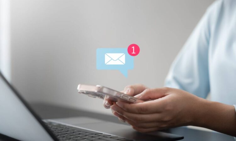 Business woman using smartphone with notifications.