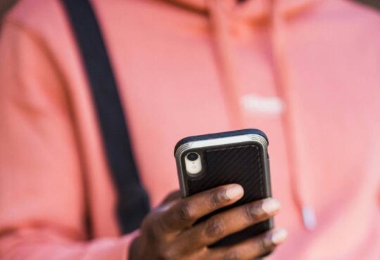 Person messaging on their phone
