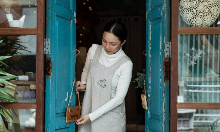Woman opening store door.
